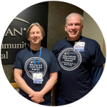 Certified nurses Pat Bria and Jerry Brenner smiling in special Certified Nurses Day t-shits, which read 'Credentials Matter.'