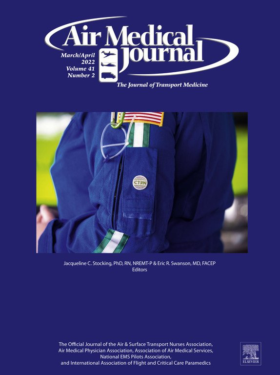 A person in a blue flight suit with an EMS patch and a pen in the sleeve pocket, featured on the cover of the March/April 2022 Air Medical Journal.