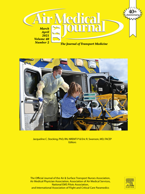 Cover of Air Medical Journal featuring medical personnel loading a patient on a stretcher into a helicopter; yellow background with journal details and 40th anniversary badge.