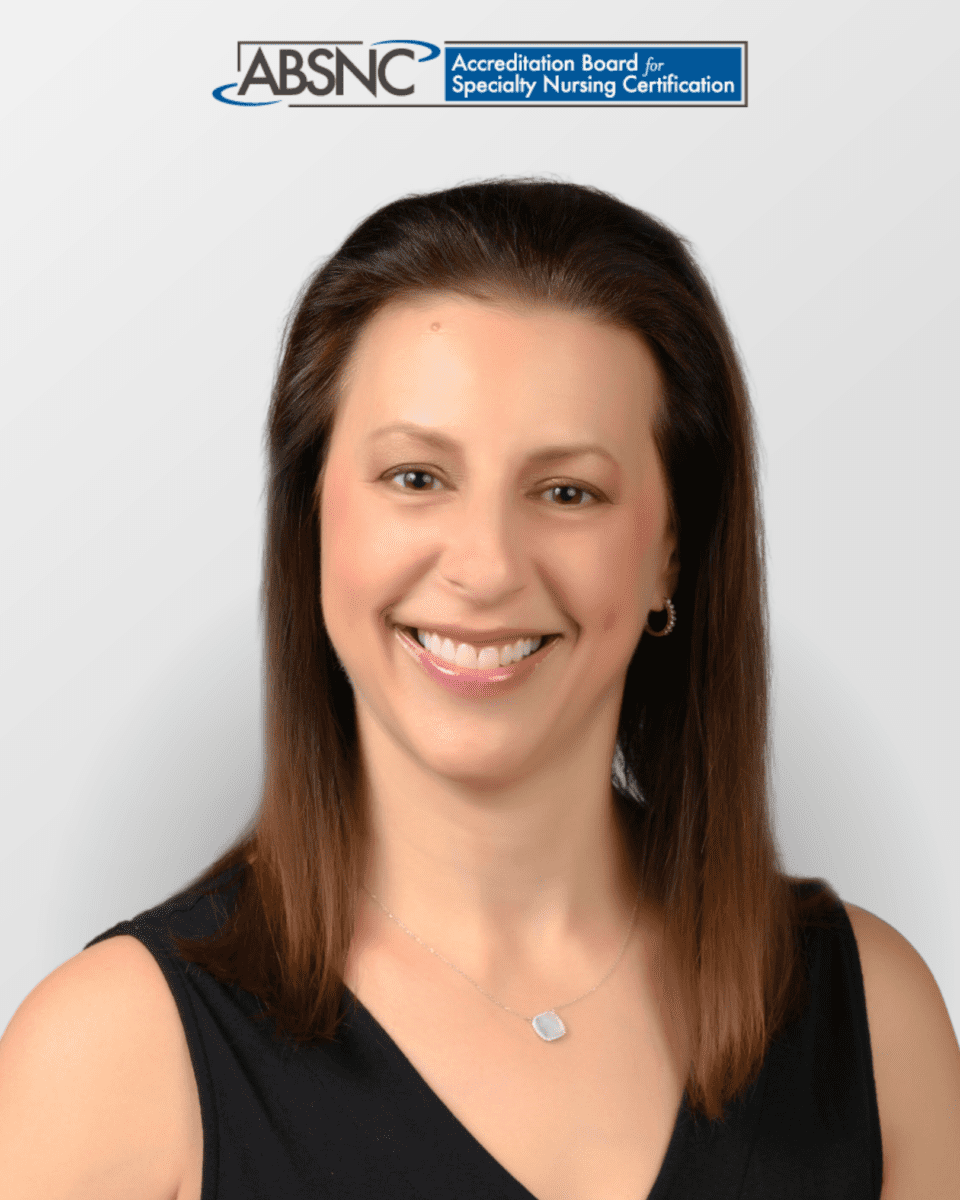 A woman with straight brown hair in a black sleeveless top smiles at the camera; ABNSC logo appears at the top of the image.