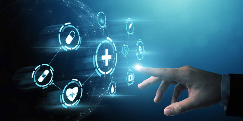 A hand pointing at virtual medical icons, including a cross, heart, pill, and syringe, illustrating digital healthcare technology on a blue background.