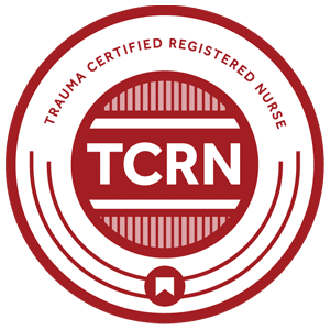 Red and white badge with the text "Trauma Certified Registered Nurse" and "TCRN" in the center, featuring a circular design and a small bookmark icon at the bottom.