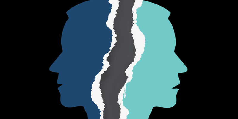 Silhouettes of two heads facing opposite directions divided by a jagged, torn line on a black background.