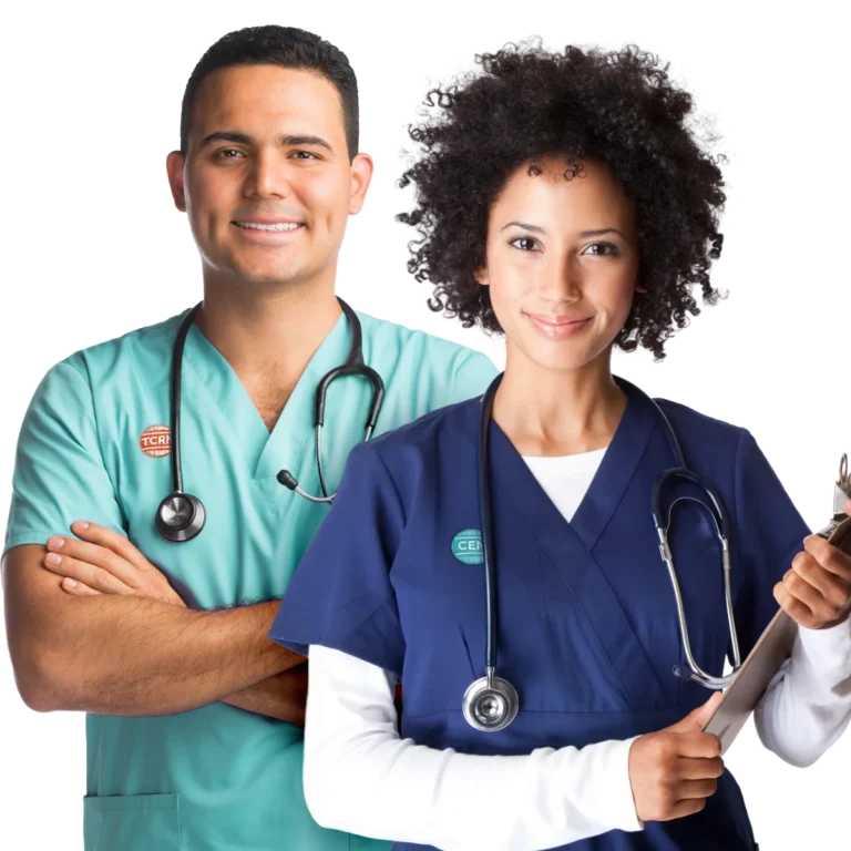 Two healthcare professionals, a man in green scrubs with a stethoscope and a woman in blue scrubs holding a clipboard, stand side by side, smiling at the camera.