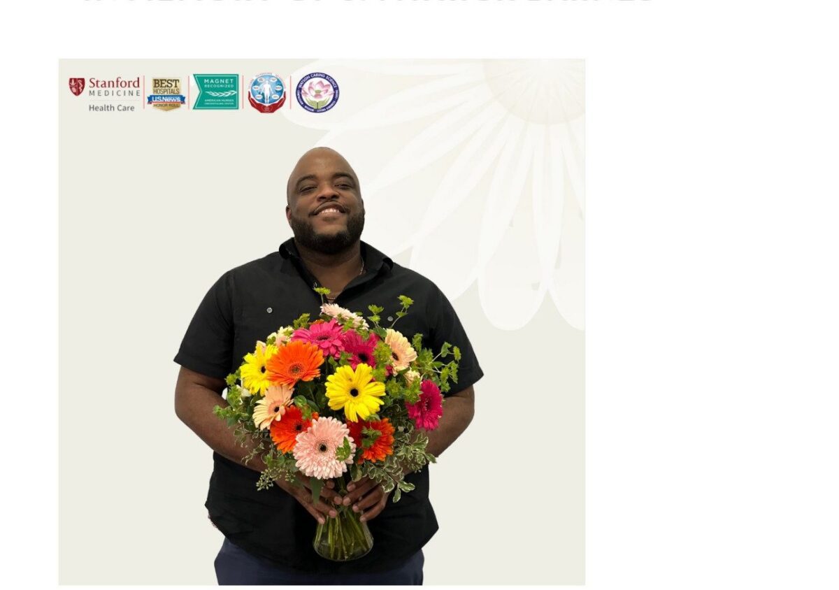 A person in a black shirt holds a large bouquet of colorful flowers. Logos for Stanford Medicine and various awards appear in the top left corner.