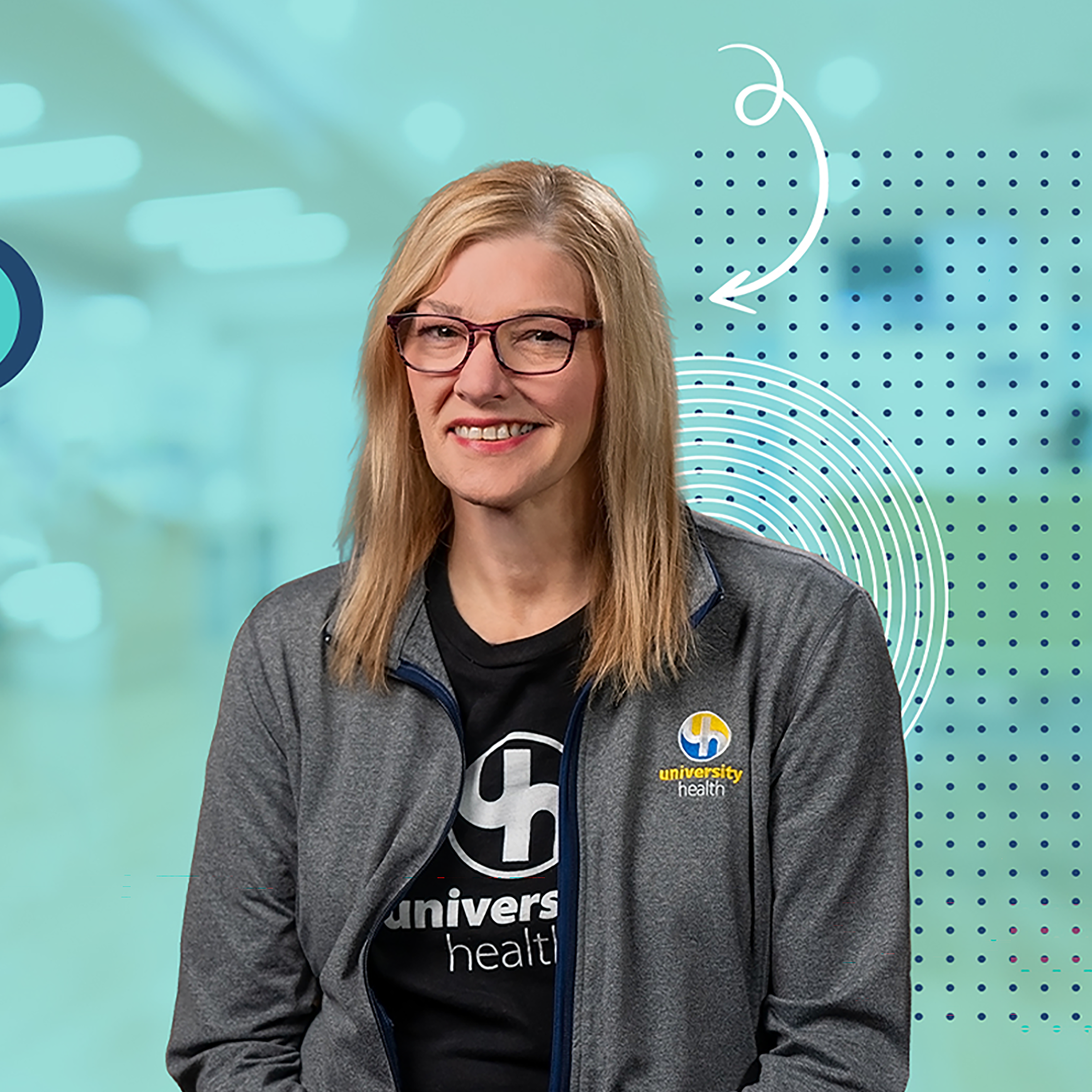 A woman with blonde hair and glasses, wearing a University Health jacket, smiles at the camera against a blue background with abstract graphic elements.