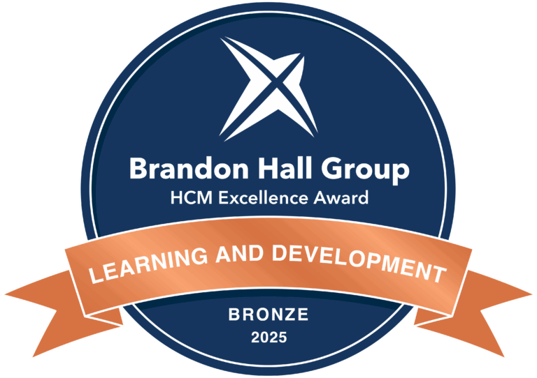 A blue circular badge displays "Brandon Hall Group HCM Excellence Award" with a bronze ribbon stating "Learning and Development, Bronze, 2025.